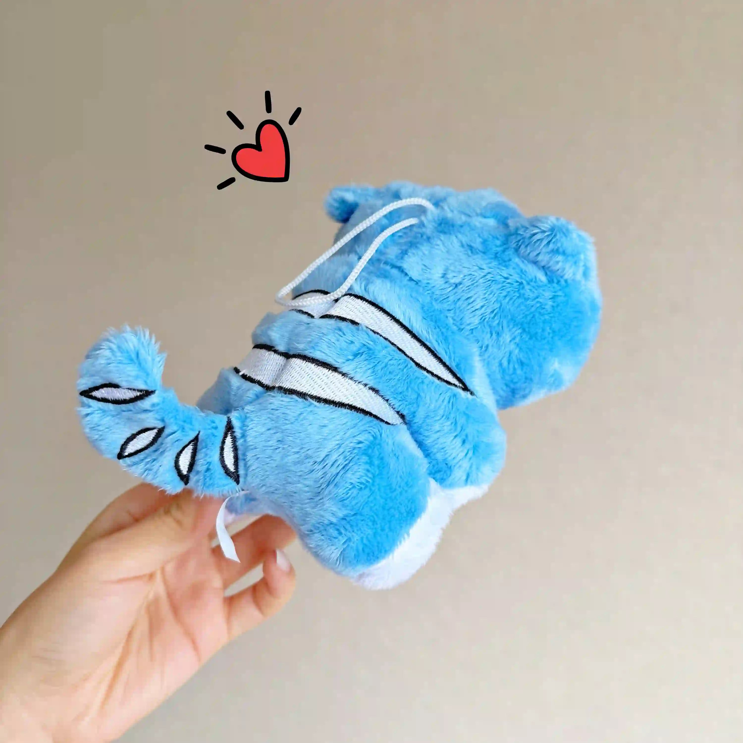 photo showing the back view of kpop demon hunters derpy the tiger plushie toy