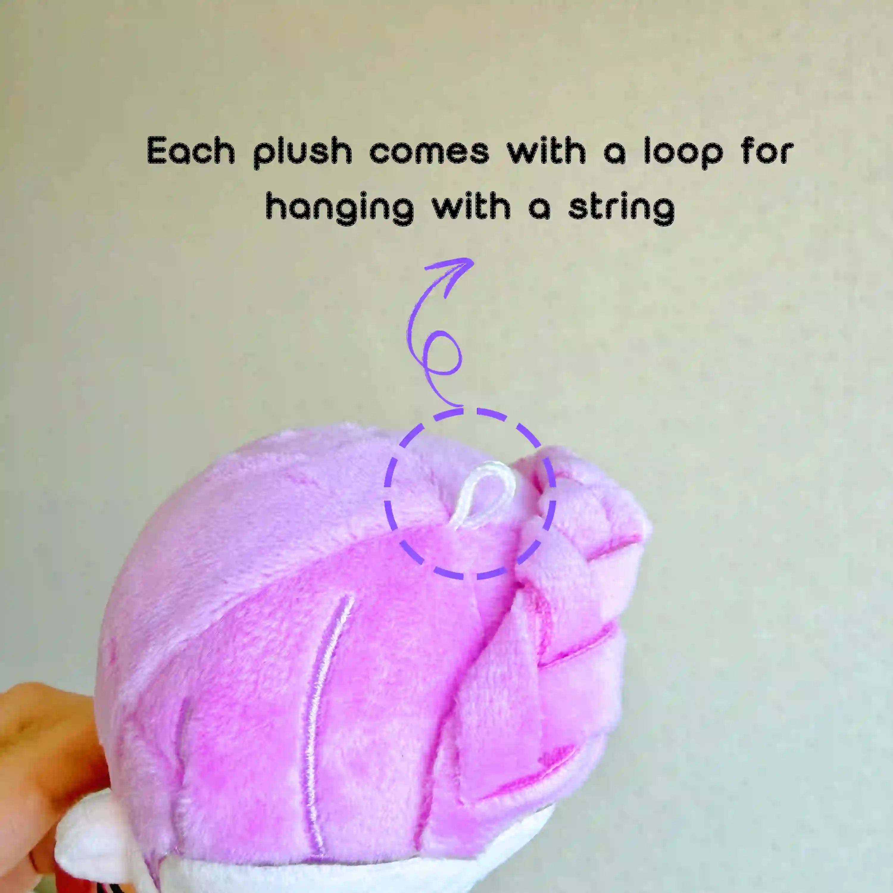 close-up photo showing the loop on the head of the kpop demon hunters plushie for hanging purpose