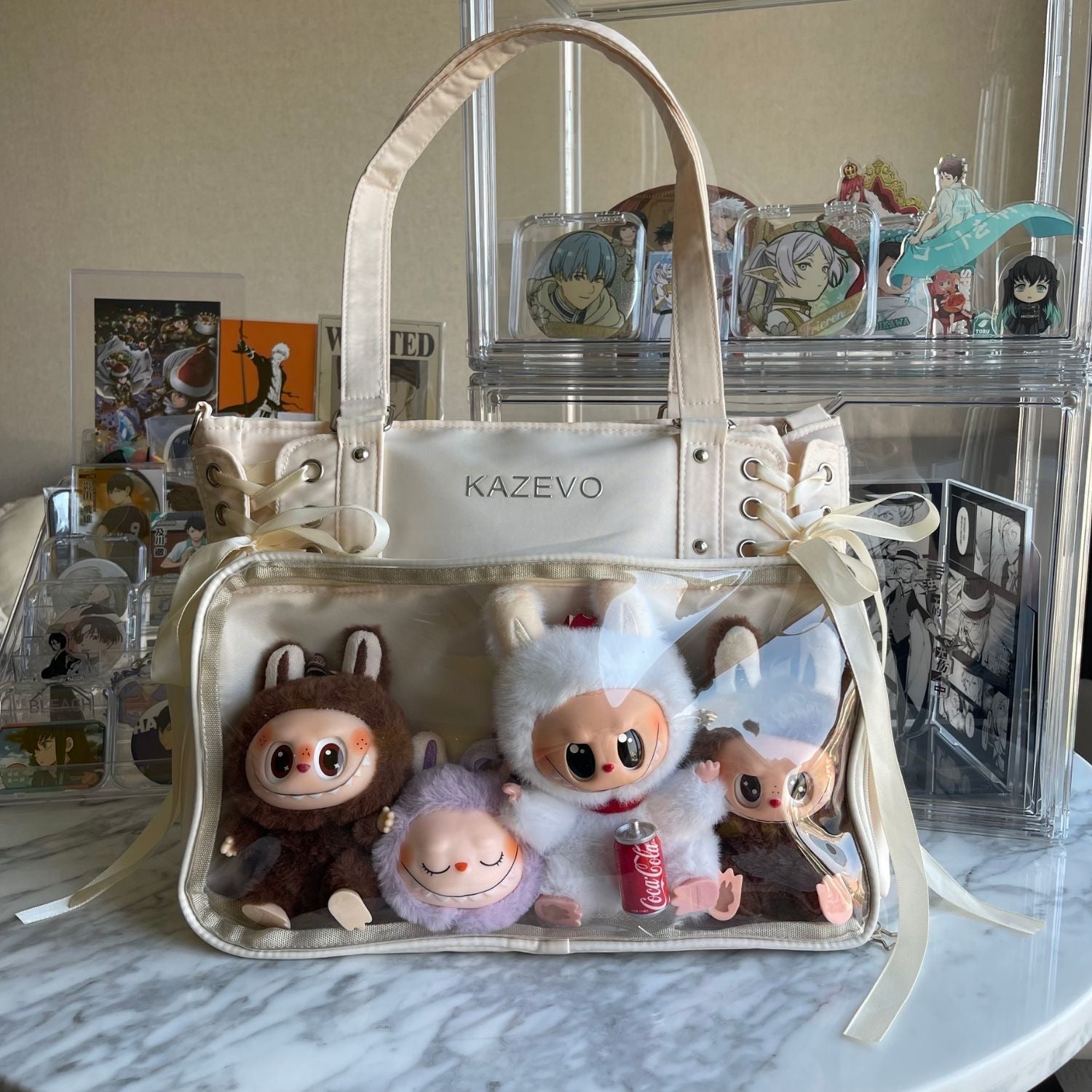 white cream ita bag on table with Labubu plushies arranged inside clear window
